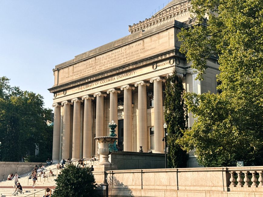 MIT campus with students walking near the Great Dome