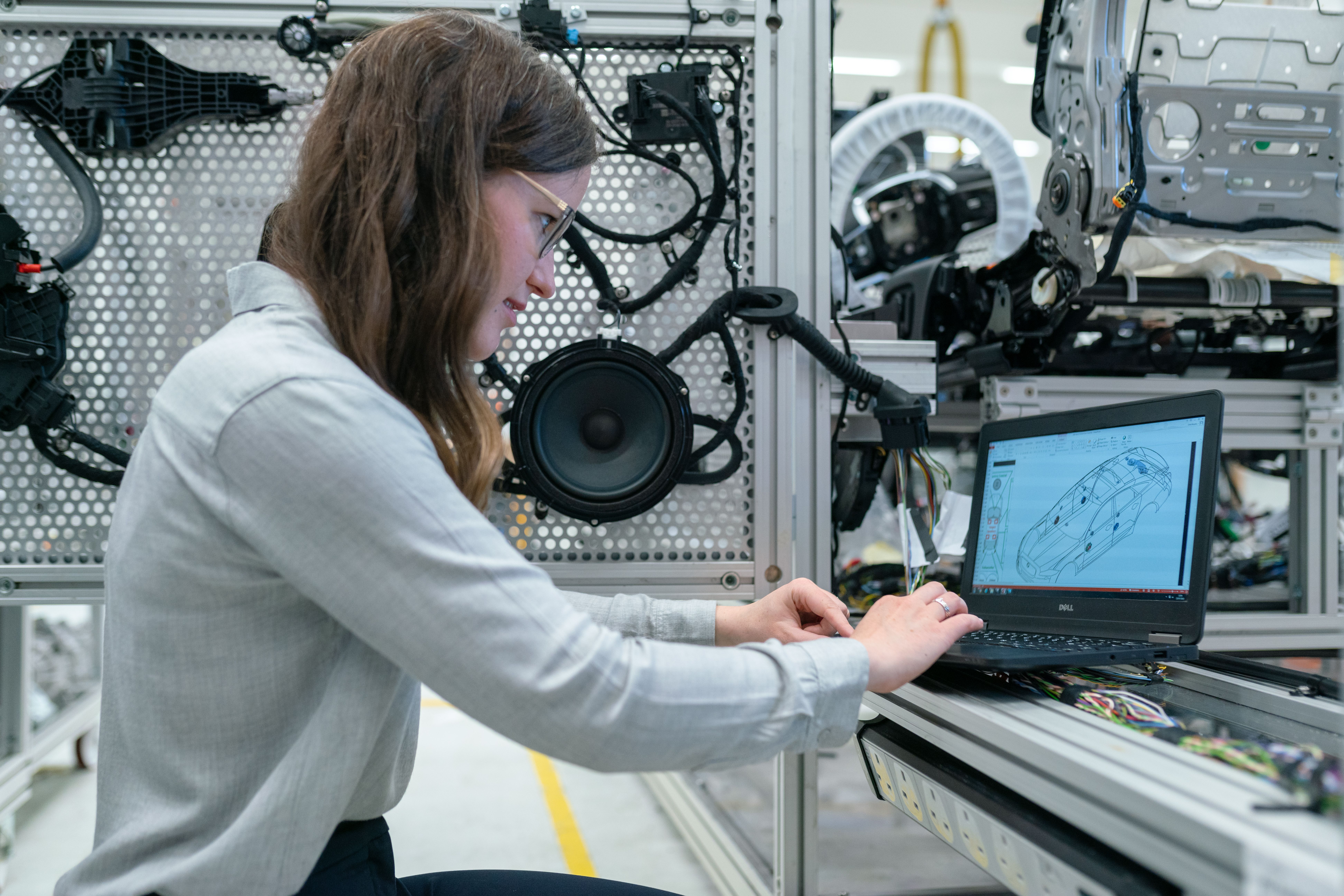 Mechanical engineering students collaborating on a robotics project in a modern lab