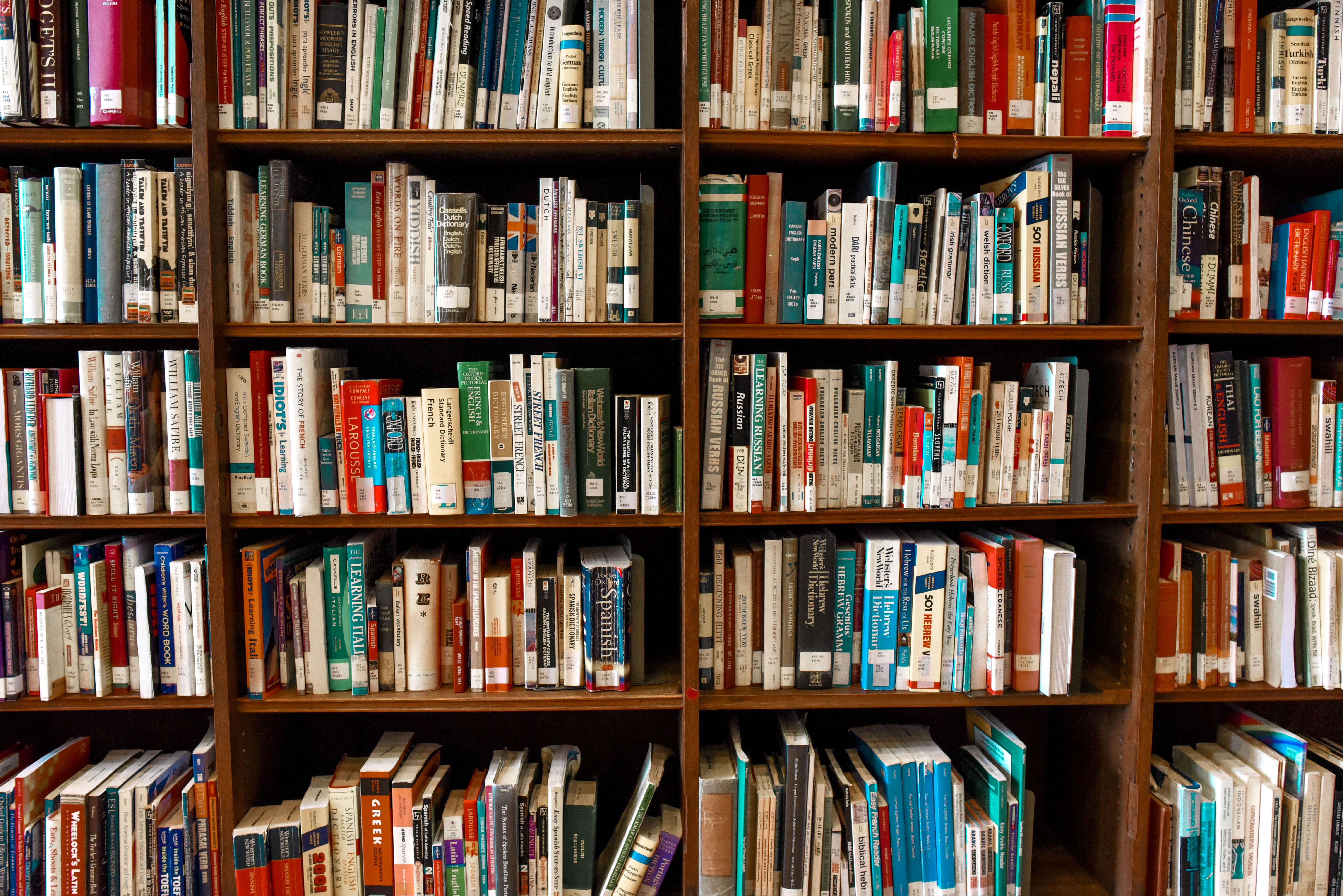 Cambridge University Library interior with wooden bookshelves and reading desks