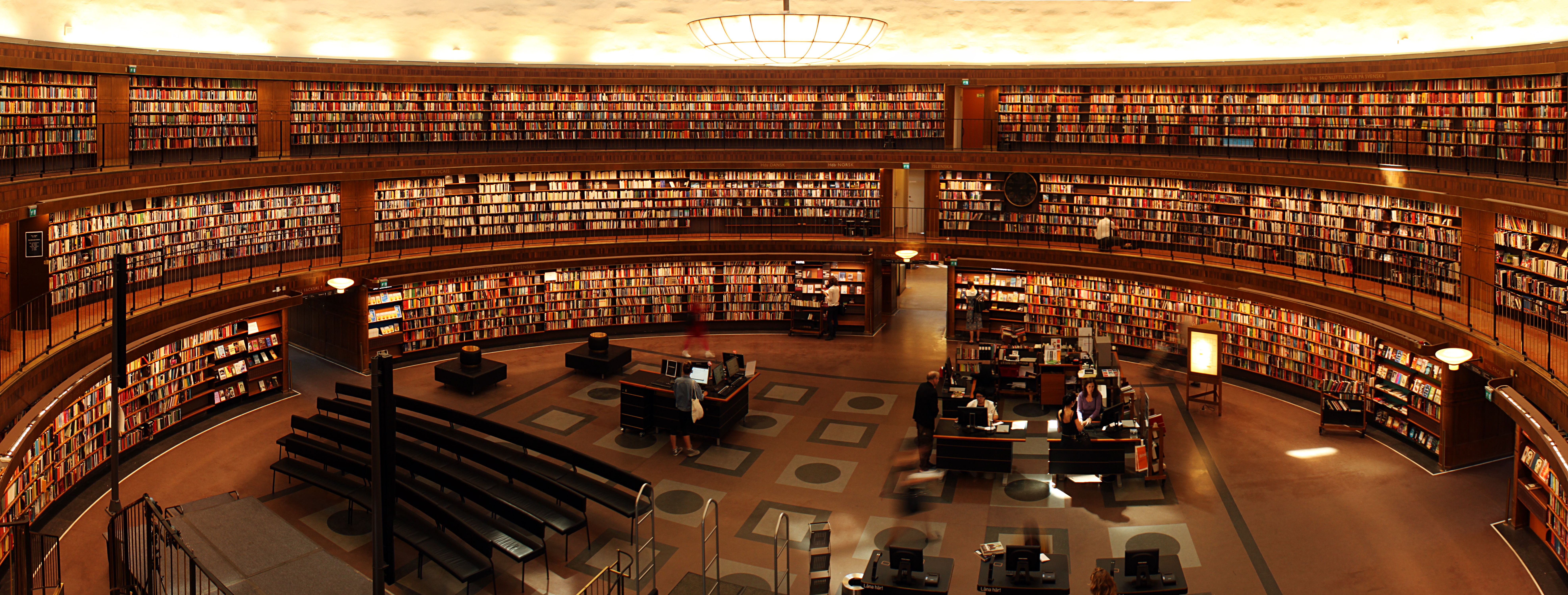 Oxford University library interior with students studying